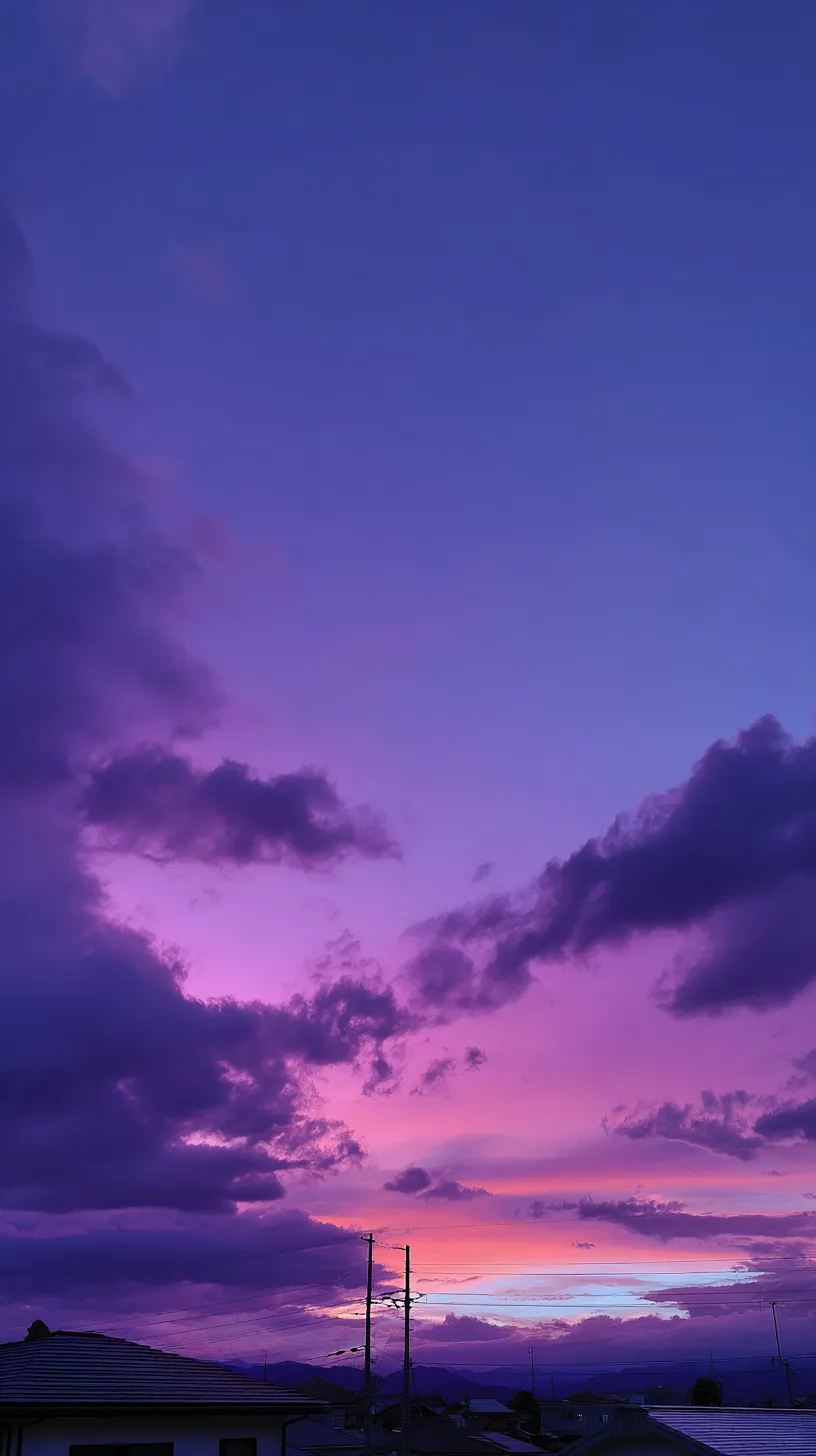 おしゃれ夜空の夕暮壁紙｜紫とピンクが混ざり合う夕暮れの空を切り取ったおしゃれ夜空の壁紙。雲の陰影が奥行きを強調し、幻想的な夕焼けの余韻を映し出している。